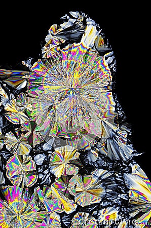 Microscopic view of citric acid crystals in polarized light Stock Photo