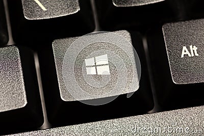 Microsoft Windows 10 operating system logo key on a black desktop computer keyboard seen from up close. PC OS button macro Editorial Stock Photo