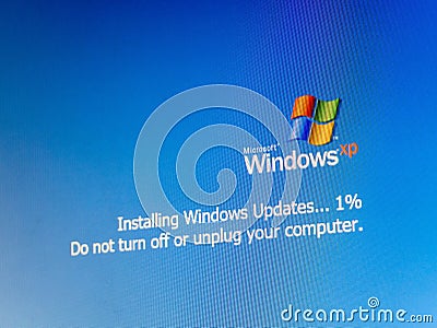 Microsoft Windows XP operating system update, installing updates one percent progress, do not turn off or unplug your computer OS Editorial Stock Photo