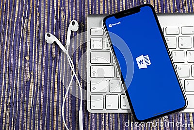 Microsoft Word application icon on Apple iPhone X screen close-up. Microsoft office word icon. Microsoft office on mobile phone. S Editorial Stock Photo