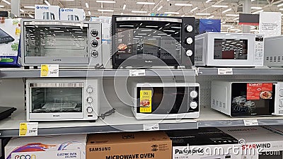 Microwaves on sale in a supermarket Editorial Stock Photo