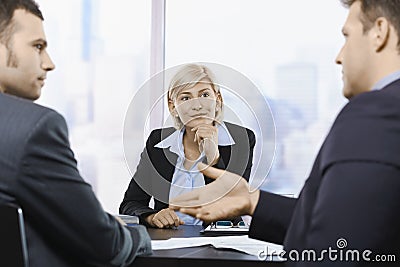 Businesswoman concentrating at meeting Stock Photo