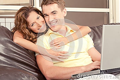 Mid adult couple with laptop Stock Photo