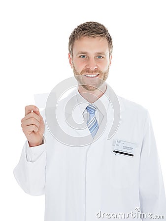 Mid Adult Doctor Holding Blank Visiting Card Stock Photo