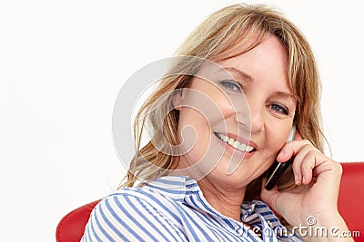Mid age businesswoman using cellphone Stock Photo