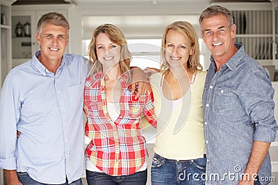 Mid age couples at home Stock Photo