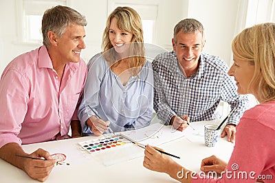 Mid age couples painting Stock Photo