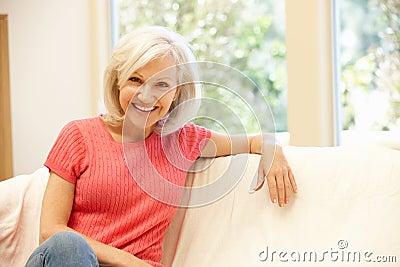Mid age woman at home Stock Photo