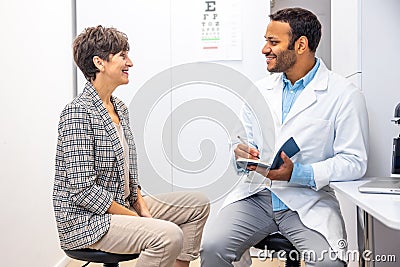 Mid aged woman having a visti to ophtalmologist Stock Photo