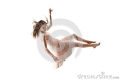 Mid-air beauty. Full length studio shot of attractive young woman hovering in air and keeping eyes closed Stock Photo