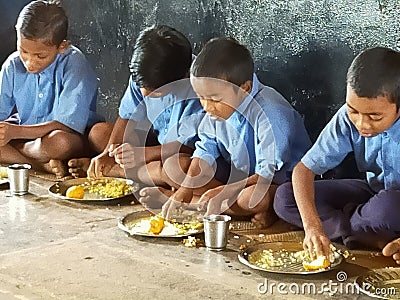 Mid-day mil in government school. Editorial Stock Photo