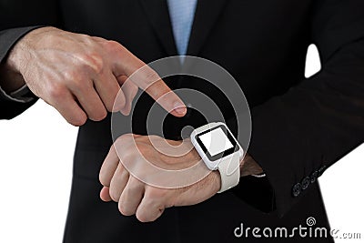 Mid section of businessman pointing on smart watch Stock Photo