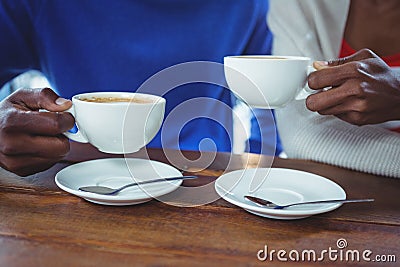 Mid section of couple having coffee Stock Photo