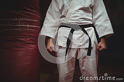 Mid section of karate player making fist Stock Photo