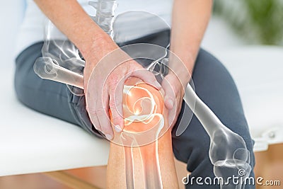 Mid section of man suffering with knee pain Stock Photo