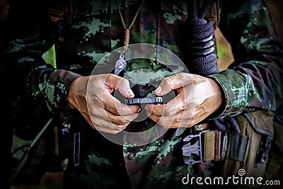 Mid section of military soldier using mobile phone in boot camp Stock Photo
