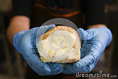 Cropped Hand Holding Baked Pastry Item Stock Photo