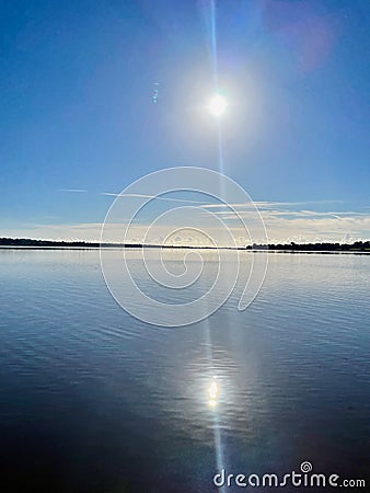 Midday sun reflecting off the ocean Stock Photo