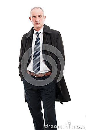 Middle age business man posing wearing raincoat Stock Photo