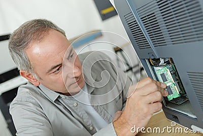 middle age man fixing electronic circuits closeup Stock Photo