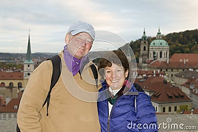 middle age senior smiling man woman tourist couple Castle District Prague Czech Republic Stock Photo