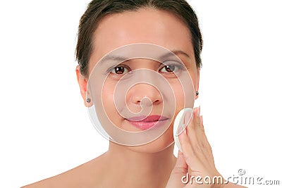 Middle age woman with a cleansing puff Stock Photo