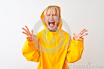 Middle age woman wearing rain coat with hood standing over isolated white background celebrating mad and crazy for success with Stock Photo