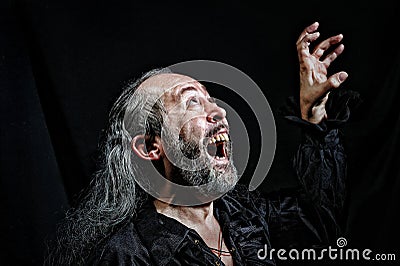 An old actor during a theatrical performance Stock Photo