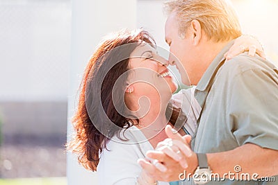 Middle Aged Couple Enjoy A Romantic Slow Dance Outside Stock Photo