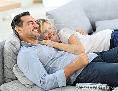 Middle-aged couple enjoying watching tv Stock Photo