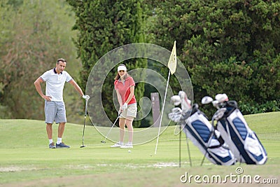 Middle aged couple on golf course Stock Photo