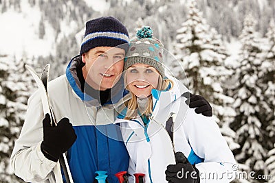 Middle Aged Couple On Ski Holiday In Mountains Stock Photo