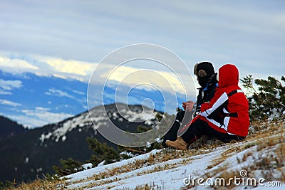 Middle-aged couple watching mountains Stock Photo