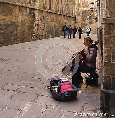 Female street musician in Barcelona street Editorial Stock Photo