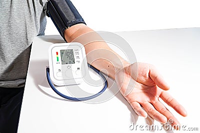 Middle-aged male patients with bp, heart rate, digital pulse monitoring device for elderly medical awareness in ischemic hypertens Stock Photo