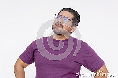 A middle aged man looking confounded and stumped, looking for questions. Wearing eyeglasses and a purple waffle shirt, Isolated on Stock Photo