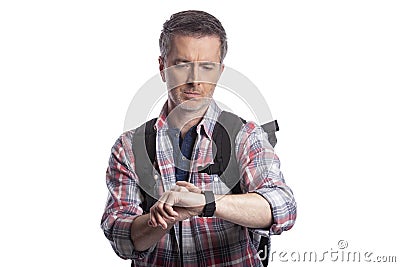 Middle-Aged Man Checking Pulse with Smartwatch Health Apps Stock Photo