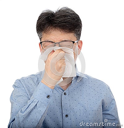 A middle-aged man suffering from rhinitis on white background Stock Photo