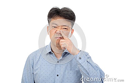 A middle-aged man suffering from rhinitis on white background Stock Photo