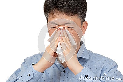 A middle-aged man suffering from rhinitis on white background Stock Photo