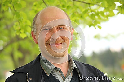 Middle-aged man in the summer park Stock Photo