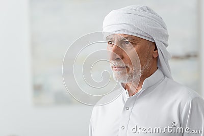 middle aged mislim man in white Stock Photo