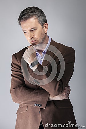 Middle Aged Model Posing with Smartwatch Used for Health Apps Stock Photo