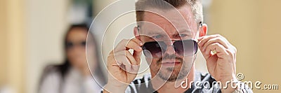 Middle aged stylish male wearing sunglasses, handsome person posing for picture Stock Photo
