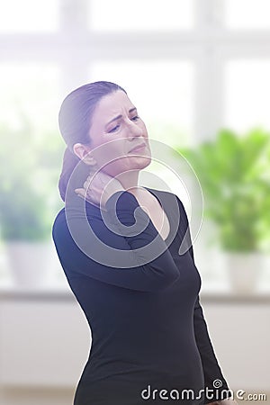Middle aged woman acute neck pain Stock Photo