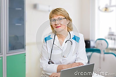 The female doctor is in the doctor`s office with medical equipment Stock Photo