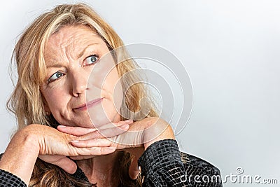 Middle Aged Woman Looking Inquisitive or Questioning Stock Photo