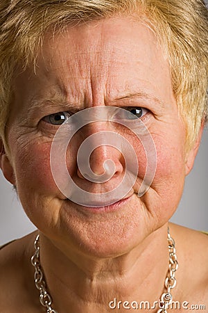 Middle-aged woman with quizzical expression Stock Photo