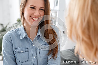 Female psychologyst therapy session with client indoors sitting patient smiling cheerful close-up Stock Photo