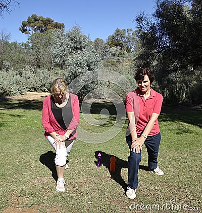 Middle-aged Women Stretching Legs Before Exercise. Stock Photo